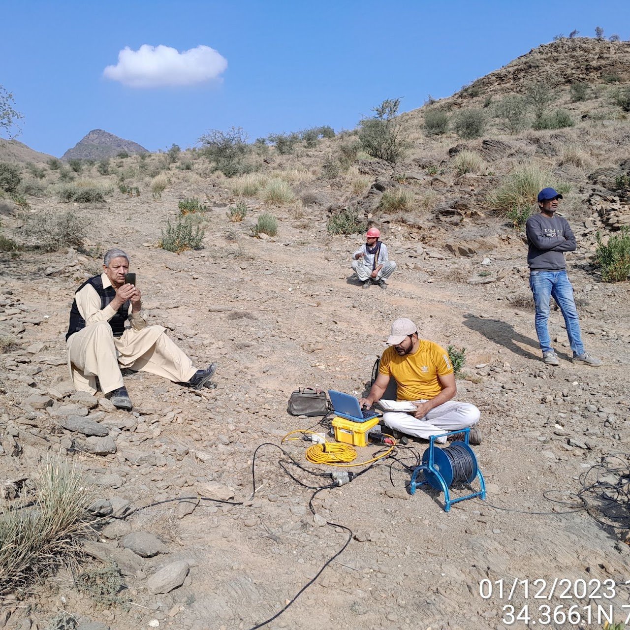 Seismic refraction crew in mountain terrain